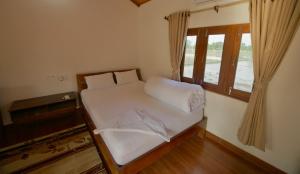 Postel nebo postele na pokoji v ubytování Bardia Eco Friendly Homestay