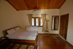 Postel nebo postele na pokoji v ubytování Bardia Eco Friendly Homestay