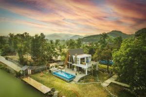 an aerial view of a house with a swimming pool at LaLa Villas Venuestay in Hòa Bình