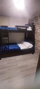 two bunk beds in a room with a brick wall at Apto 8-32 in Santa Rosa de Cabal +2 photos