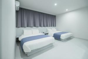 Aank Air Hotel Jinjuseong客房内的一张或多张床位