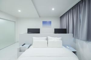 Aank Air Hotel Jinjuseong客房内的一张或多张床位