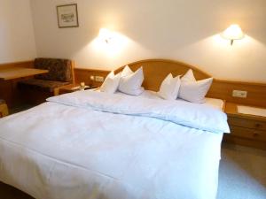 Postel nebo postele na pokoji v ubytování Hotel Stocker