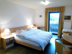 Postel nebo postele na pokoji v ubytování Hotel Stocker