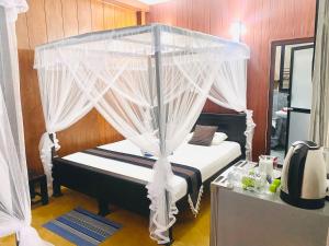 Letto o letti in una camera di Coco Palm Villa and Cabanas