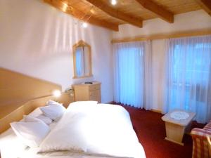 Postel nebo postele na pokoji v ubytování Hotel Stocker