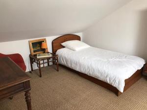 En eller flere senge i et værelse på Petite maison cosy