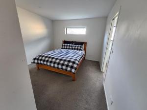 Postel nebo postele na pokoji v ubytování RemarkableStay