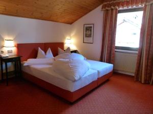Postel nebo postele na pokoji v ubytování Hotel Stocker