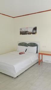 Postel nebo postele na pokoji v ubytování Selow Homestay