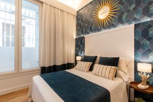 Posteľ alebo postele v izbe v ubytovaní Apartamentos RG Goyeneta