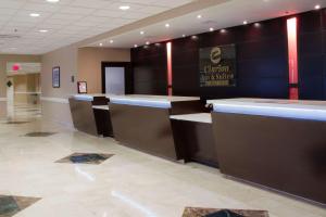 a lobby of a dental office with a counter at Clarion Inn & Suites Miami International Airport in Miami