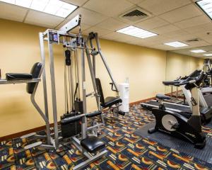 a gym with treadmills and exercise bikes in a room at Clarion Inn & Suites Miami International Airport in Miami