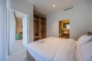 Ein Bett oder Betten in einem Zimmer der Unterkunft The Signature Suite in Mercury Tower
