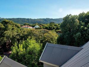 a view from the roof of a house with trees at Avemore Island Apartment Sedgefield in Sedgefield