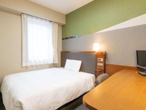 Postel nebo postele na pokoji v ubytování Comfort Hotel Toyama + 30 fotografií