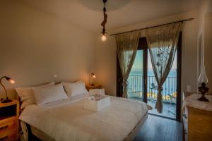 Postel nebo postele na pokoji v ubytování Yades Villas + 35 fotografií