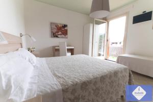Posteľ alebo postele v izbe v ubytovaní B&B al Doremi
