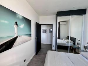 Postel nebo postele na pokoji v ubytování Les terrasses de Cap d Ail 2 - Vue Mer