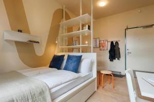 Postel nebo postele na pokoji v ubytování MOWO ConneKT - Monteurwohnungen in Kitzingen