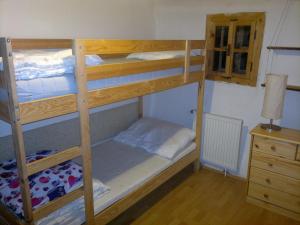 A bed or beds in a room at Chalupa U Kurišky