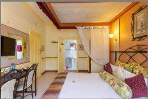 Postel nebo postele na pokoji v ubytování Kahama Hotel Nairobi