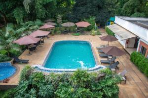 an overhead view of a swimming pool with umbrellas at Heri Heights Hotel Apartments, SureStay Collection by Best Western in Nairobi