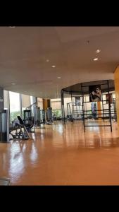 a large room with a wooden floor and a mirror at The RADIANCE MANILA BAY in Manila