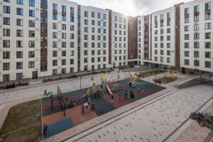 an aerial view of a playground in front of buildings at ЖК Discovery in Promyshlennyy