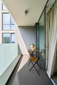 a balcony with a table and a chair at Adella Boutique Hotel - Free Secured Parking in Sofia