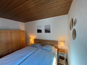 Postel nebo postele na pokoji v ubytování Appartement Sonnenblume - Haus Kärnten