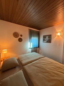 Postel nebo postele na pokoji v ubytování Appartement Sonnenblume - Haus Kärnten