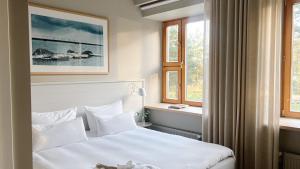 Postel nebo postele na pokoji v ubytování LaSpa Beach House