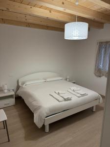 Postel nebo postele na pokoji v ubytování Sogno delle Dolomiti