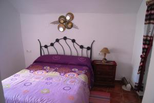 Ένα ή περισσότερα κρεβάτια σε δωμάτιο στο Cueva de María 1