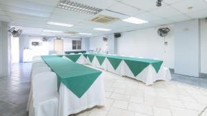 a long table with a green and white table cloth at RedDoorz @ Yahweh Spring Retreat & Resort Laguna in Calamba +81 photos
