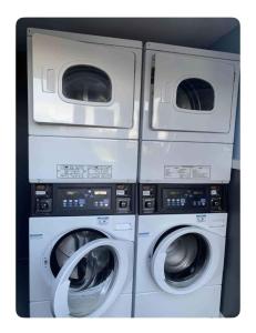 three washing machines are stacked next to each other at Seaside 2 bed Chalet Escape in Mablethorpe in Mablethorpe +14 photos