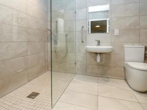 a bathroom with a shower and a toilet and a sink at The Nest in Carlisle +15 photos