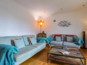a living room with two couches and a coffee table at Tides Reach in Rhosneigr