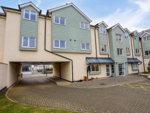 a row of houses on a street at Tides Reach in Rhosneigr