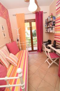 a living room with a couch and a table at Villa Erato in Kineta