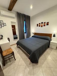 Voodi või voodid majutusasutuse Hotel Duca di Tromello toas