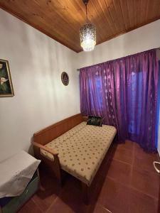 Postel nebo postele na pokoji v ubytování Anilio House