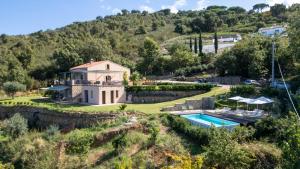 an aerial view of a house on a hill with a swimming pool at B&B Le Ginestre in Cefalù