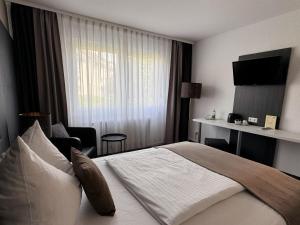 Postel nebo postele na pokoji v ubytování Eisberg Hotel Schwanen