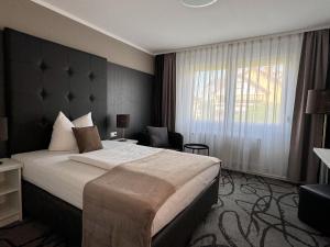 Postel nebo postele na pokoji v ubytování Eisberg Hotel Schwanen