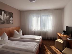 Postel nebo postele na pokoji v ubytování Eisberg Hotel Schwanen