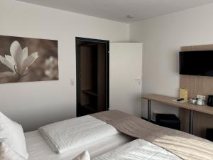 Postel nebo postele na pokoji v ubytování Eisberg Hotel Schwanen