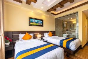 Letto o letti in una camera di Devo Boutique Hotel