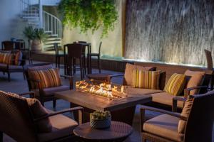 a patio with couches and tables and a fountain at The Westin South Coast Plaza, Costa Mesa in Costa Mesa